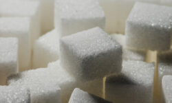 Extreme close-up of stacked cubes of sugar, under low key lighting