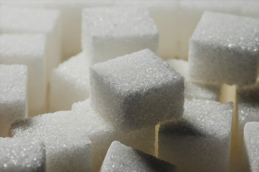 Extreme close-up of stacked cubes of sugar, under low key lighting